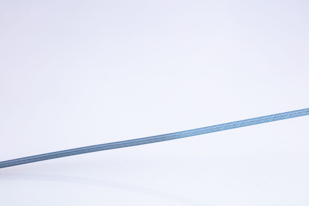 Braid reinforced tubing with variable pics