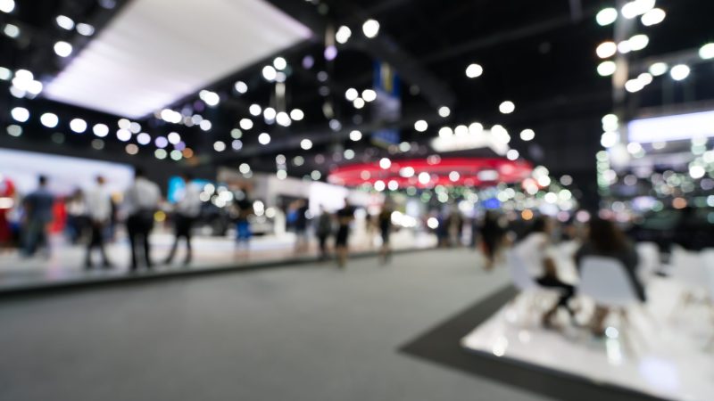 blurred image of people at a tradeshow