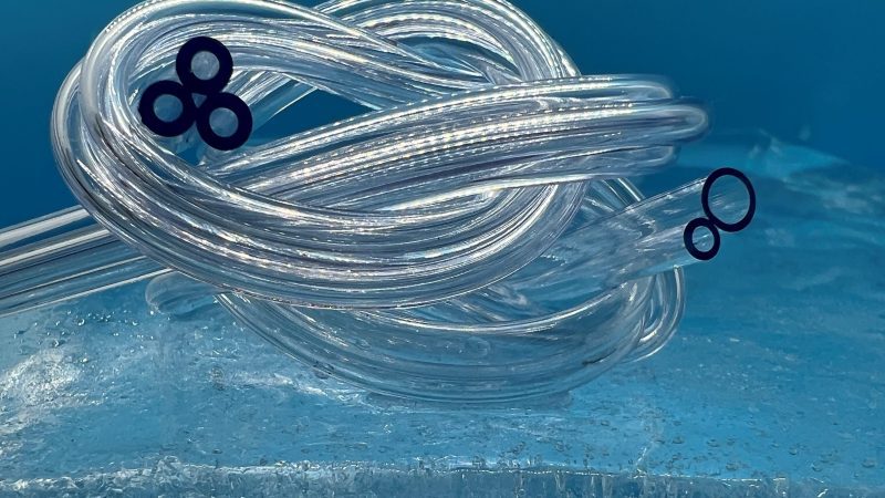 2 images of parallel tubing sitting on a block of ice