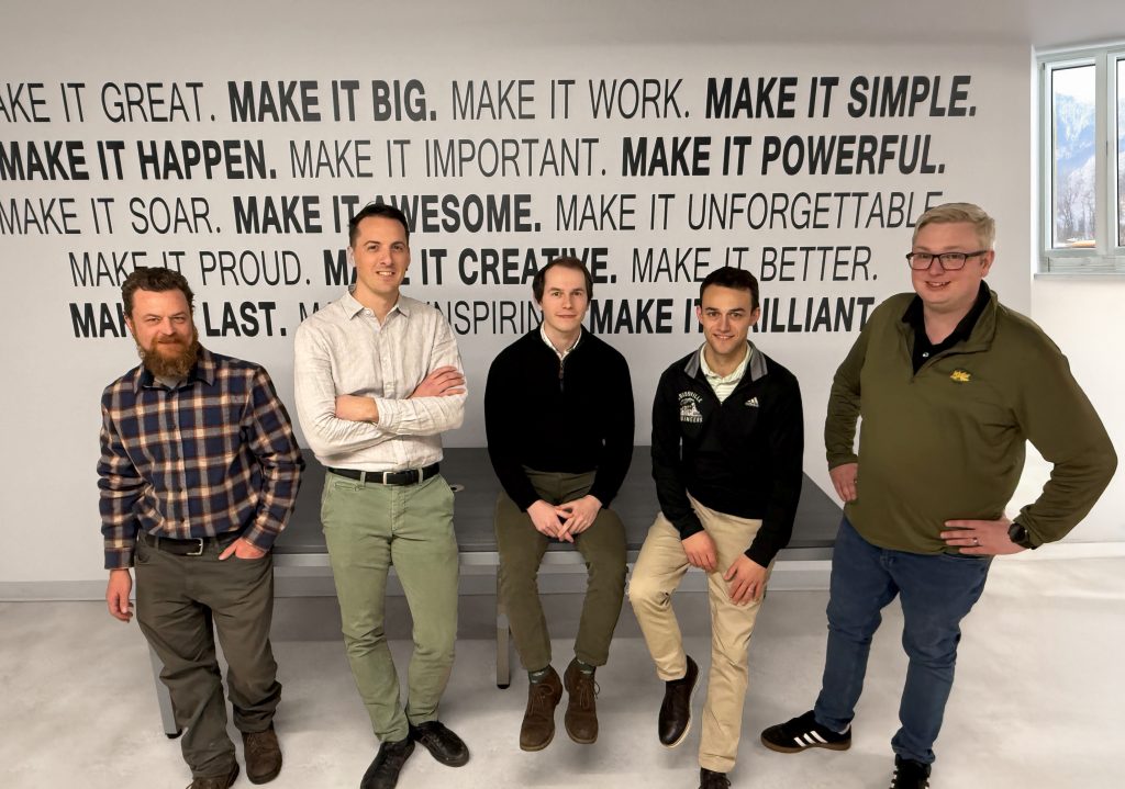 Five male engineers from the New England Tubing team