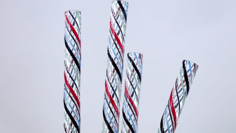 four pieces of clear tubing with conductors in the wall of the tube